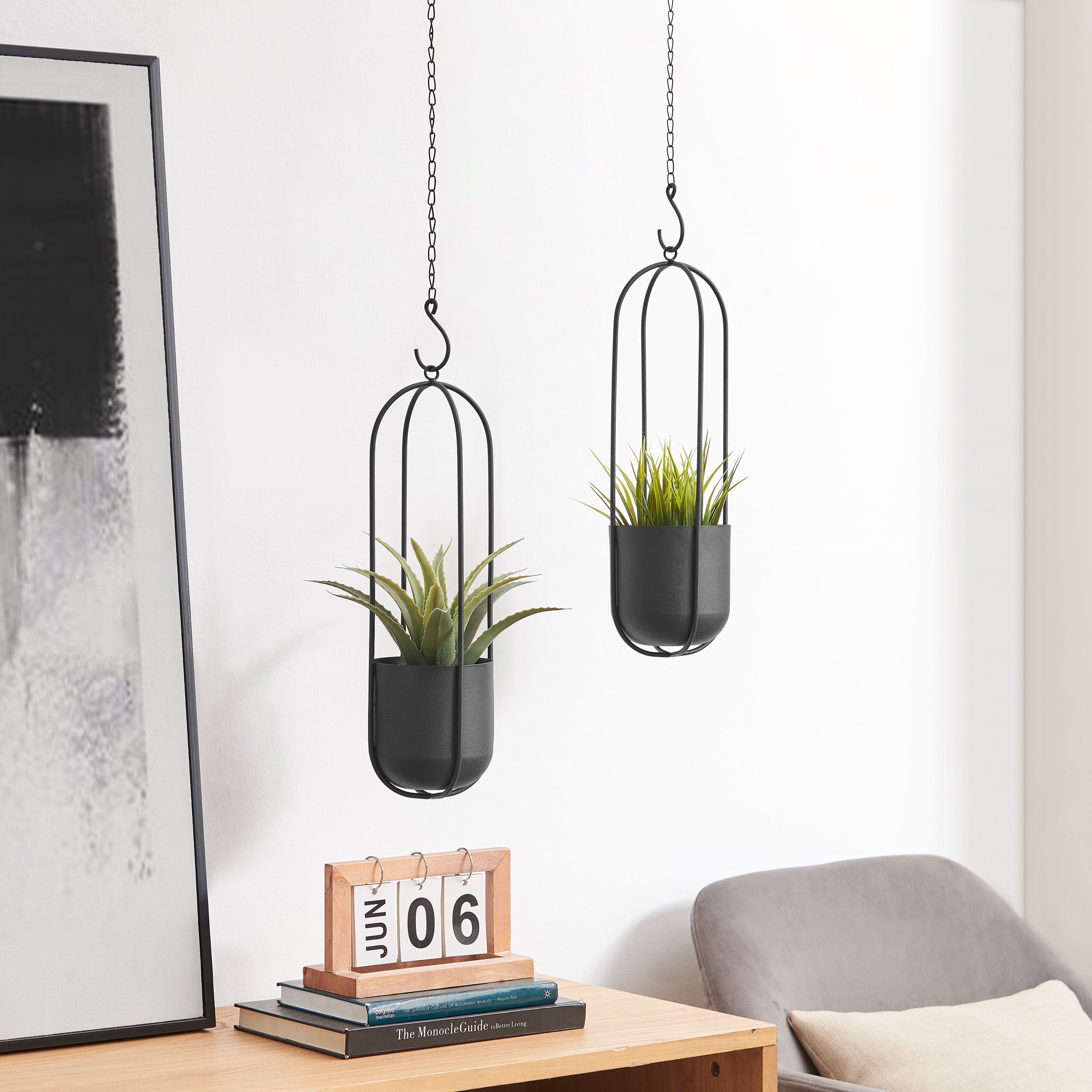 small black hanging planter Danya B. Walter 2-Piece Modern Black Metal Oval Hanging Planter Set with Chain Hanging Option